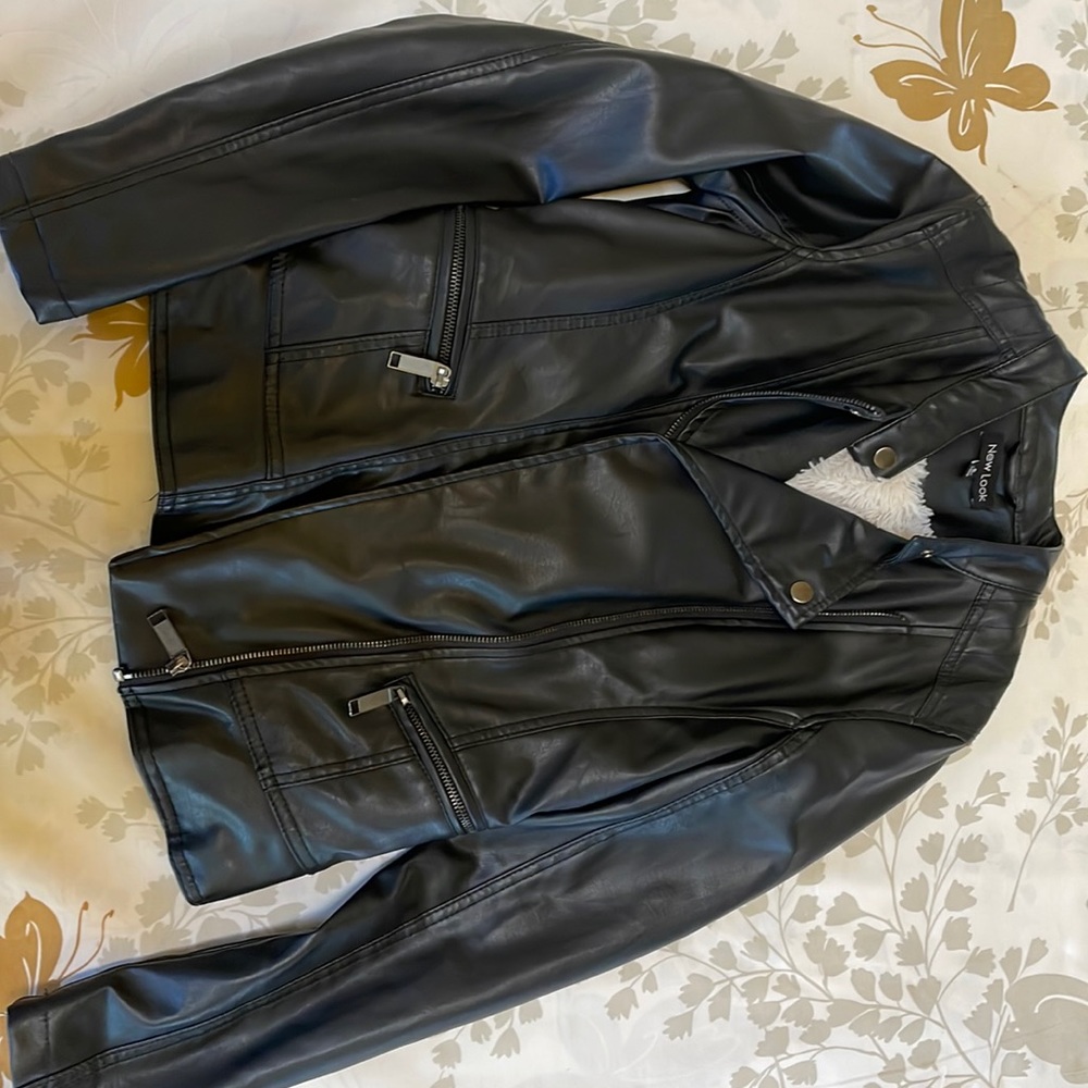 Never worn faux leather jacket with fur lining
